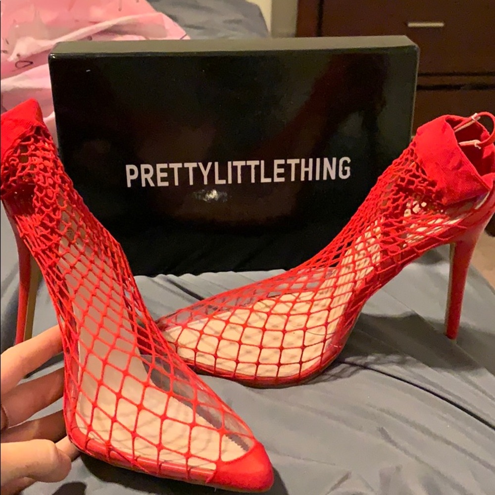 Red fishnet heels
